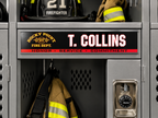 A close-up of a gray metal firefighter locker with a custom nameplate reading 'T. COLLINS' and 'ROCKY POINT FIRE DEPT.