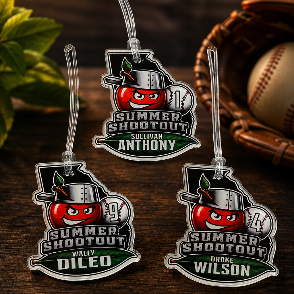 Three personalized 'Summer Shootout' keychains on a wooden surface with a baseball and glove in the background.