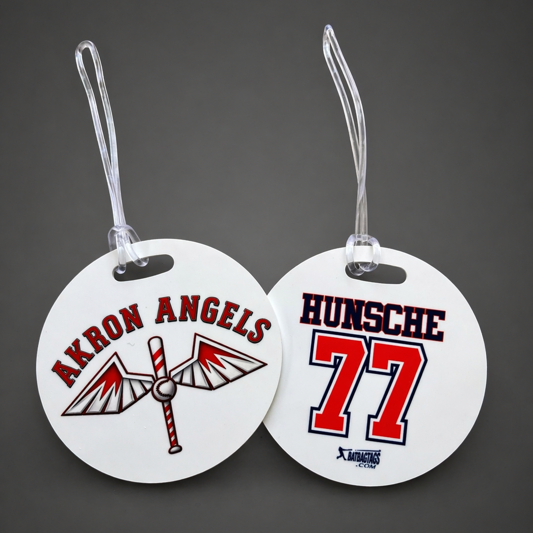 Two round tags with 'Akron Angels' and 'Hunsche 77' text on a dark background