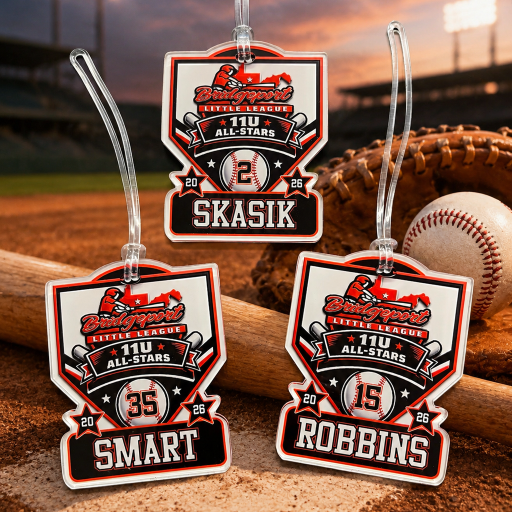 Baseball-themed name tags with player numbers on a baseball field background
